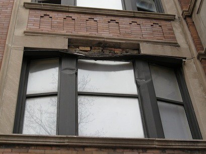 A 150 pound piece of limestone fell out of this second-story bay window head