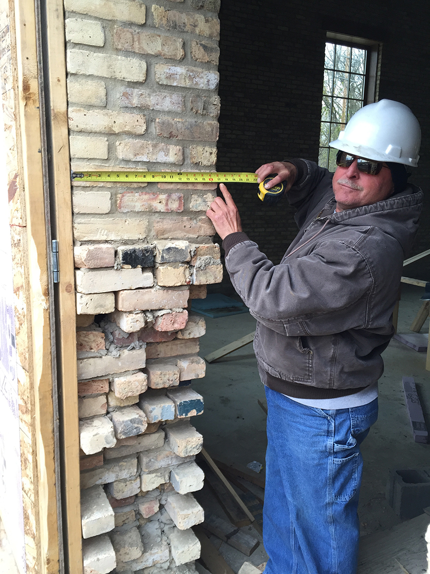 A member of our team measures out a four-wythe door jamb.