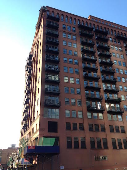 Swingstages and heavy-duty pedestrian canopies and debris nets in place at the Daniel Burnham-designed Randolph Place condominium building