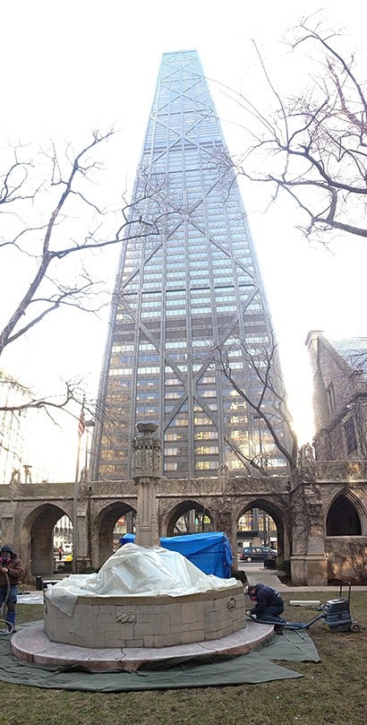 AAA-1 Masonry & Tuckpointing masons work on Fourth Presbyterian Church's historic fountain in the shadow of the John Hancock Center