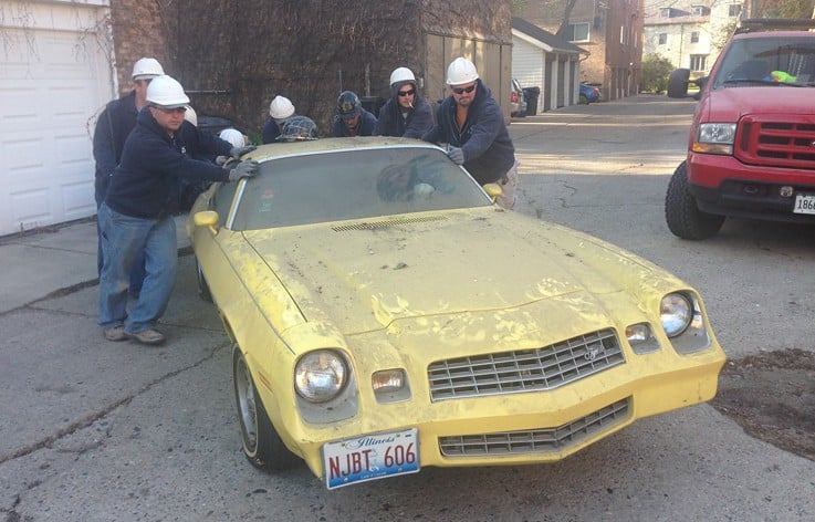 AAA-1 licensed masons pushing a 1975 Pontiac TransAm